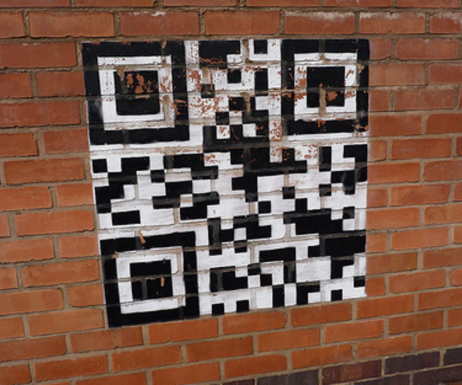 A QR code on a brick wall