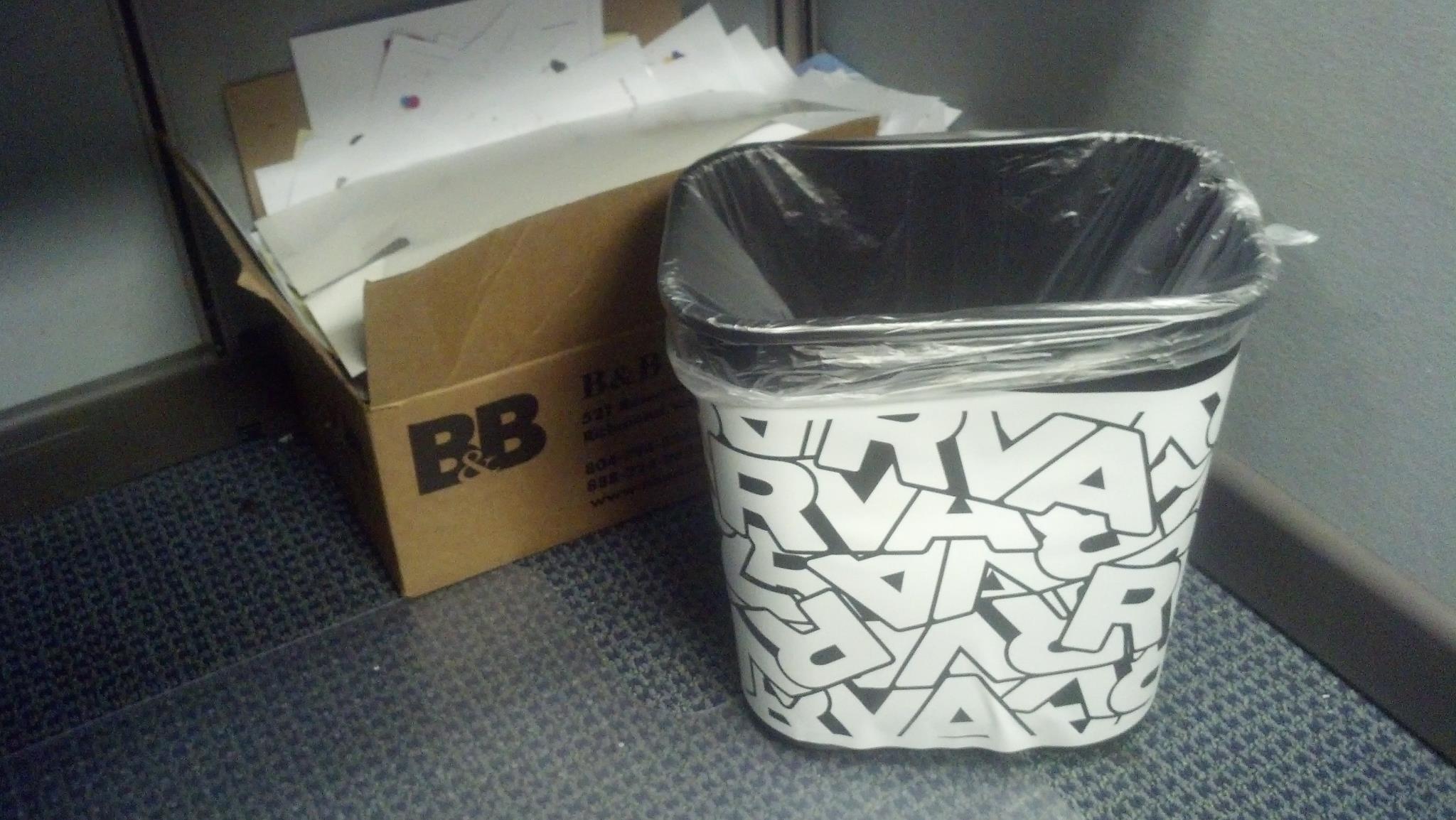 A trashcan covered with the RVA logo